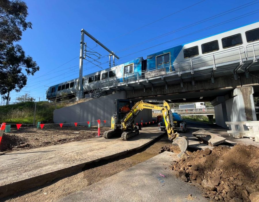 Exc under rail